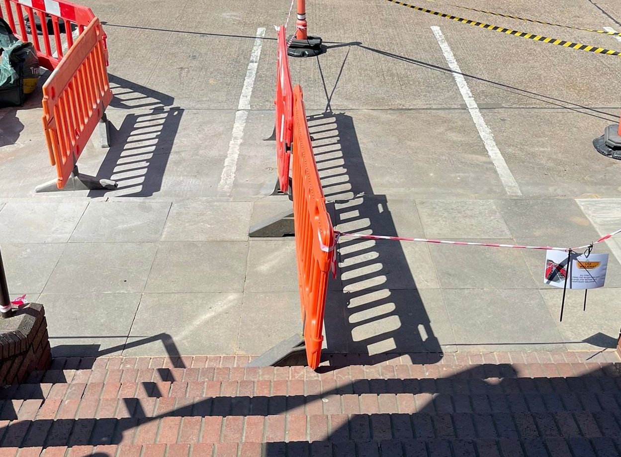 Commercial paving slabs being reinstated during external maintenance works in Coventry