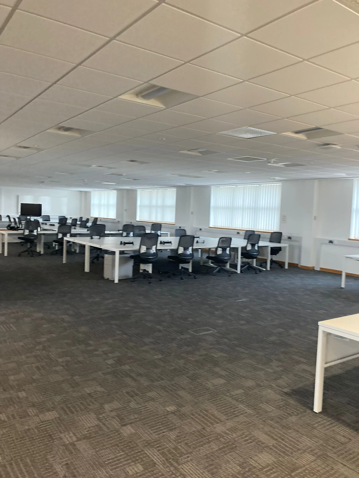 Warwick office refurbishment showing renewed flooring, ceiling tiles and decoration